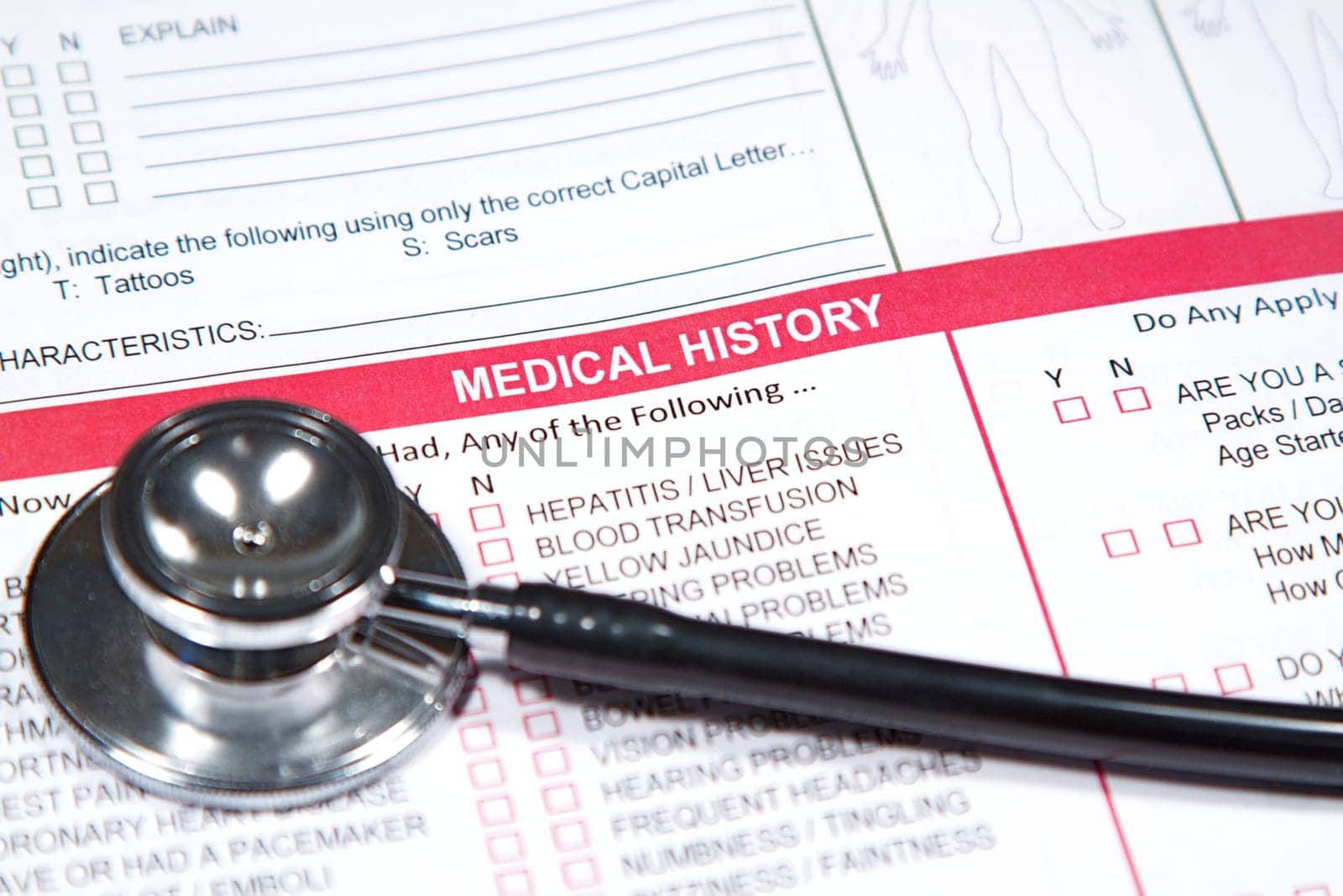 Close up of a Medical History form and a doctor&#039 s Stethoscope
