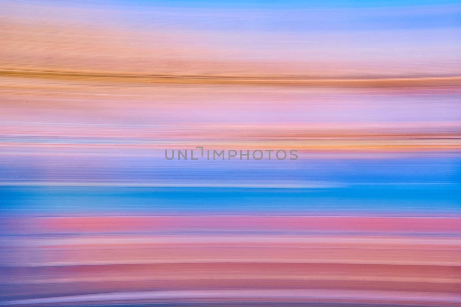 Image of Abstract streaks of pastel colors with blue framed by red and purple with orange on top