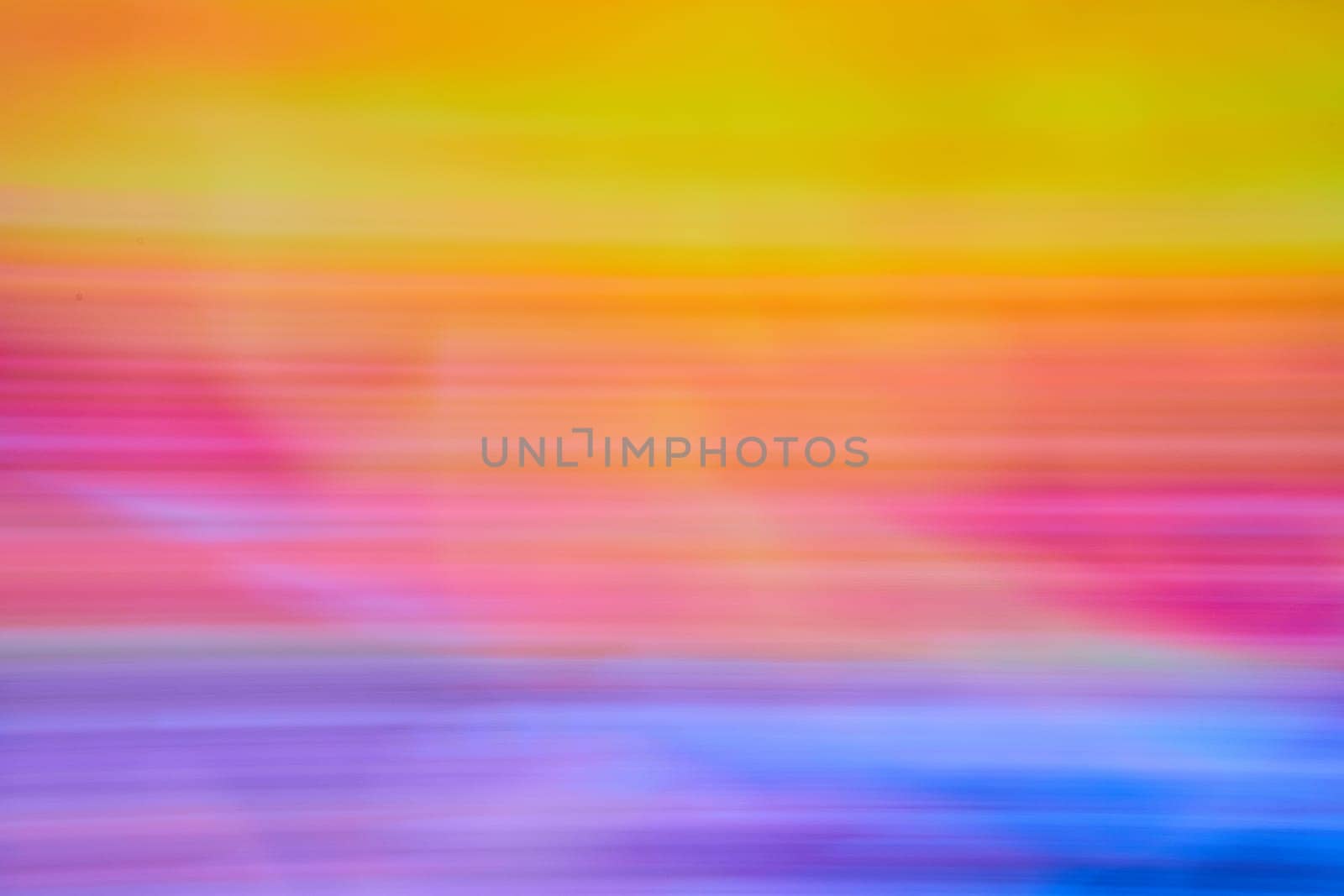 Image of Abstract sunset in three stripes of blurred colors from blue to orange on top