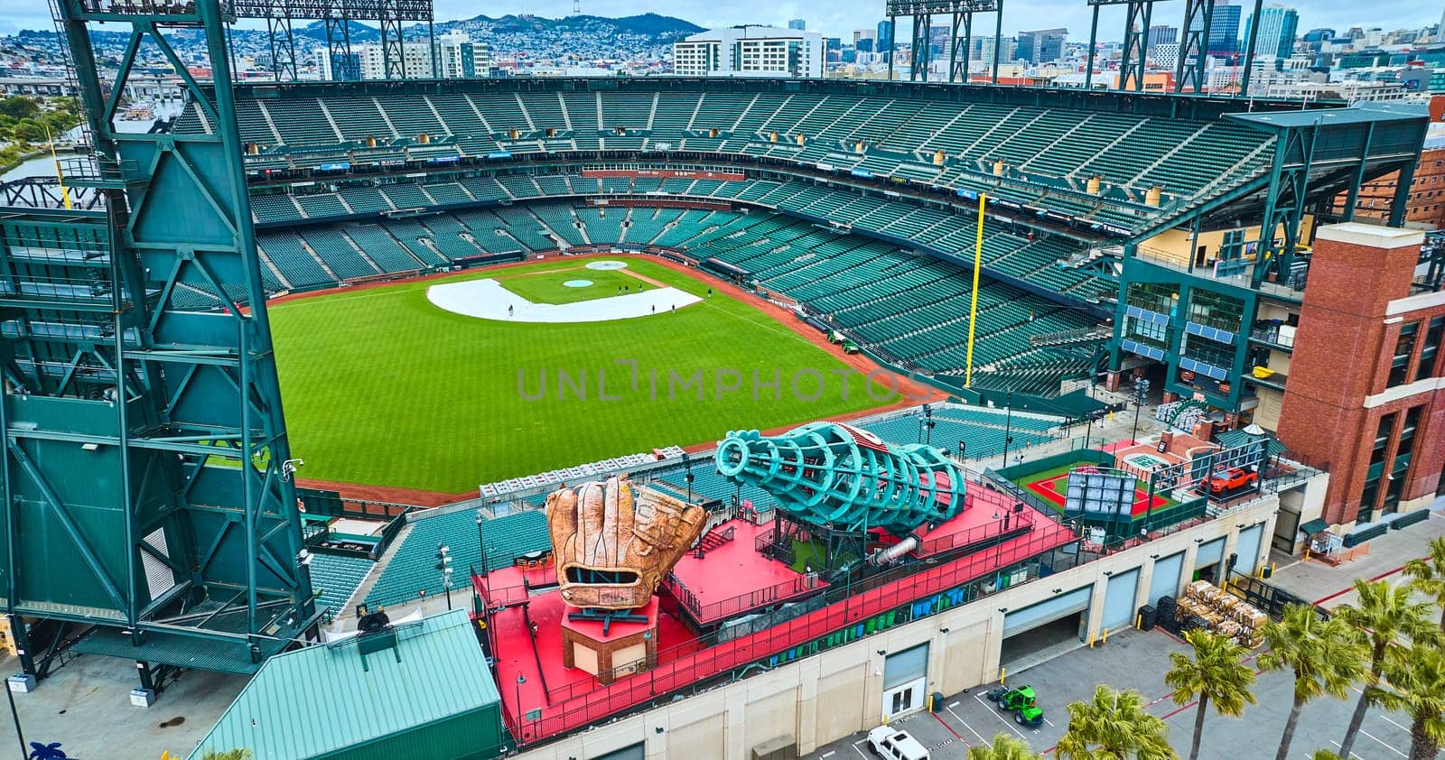 Image of Aerial Oracle Park Coca Cola slide and people on field at giants baseball diamond