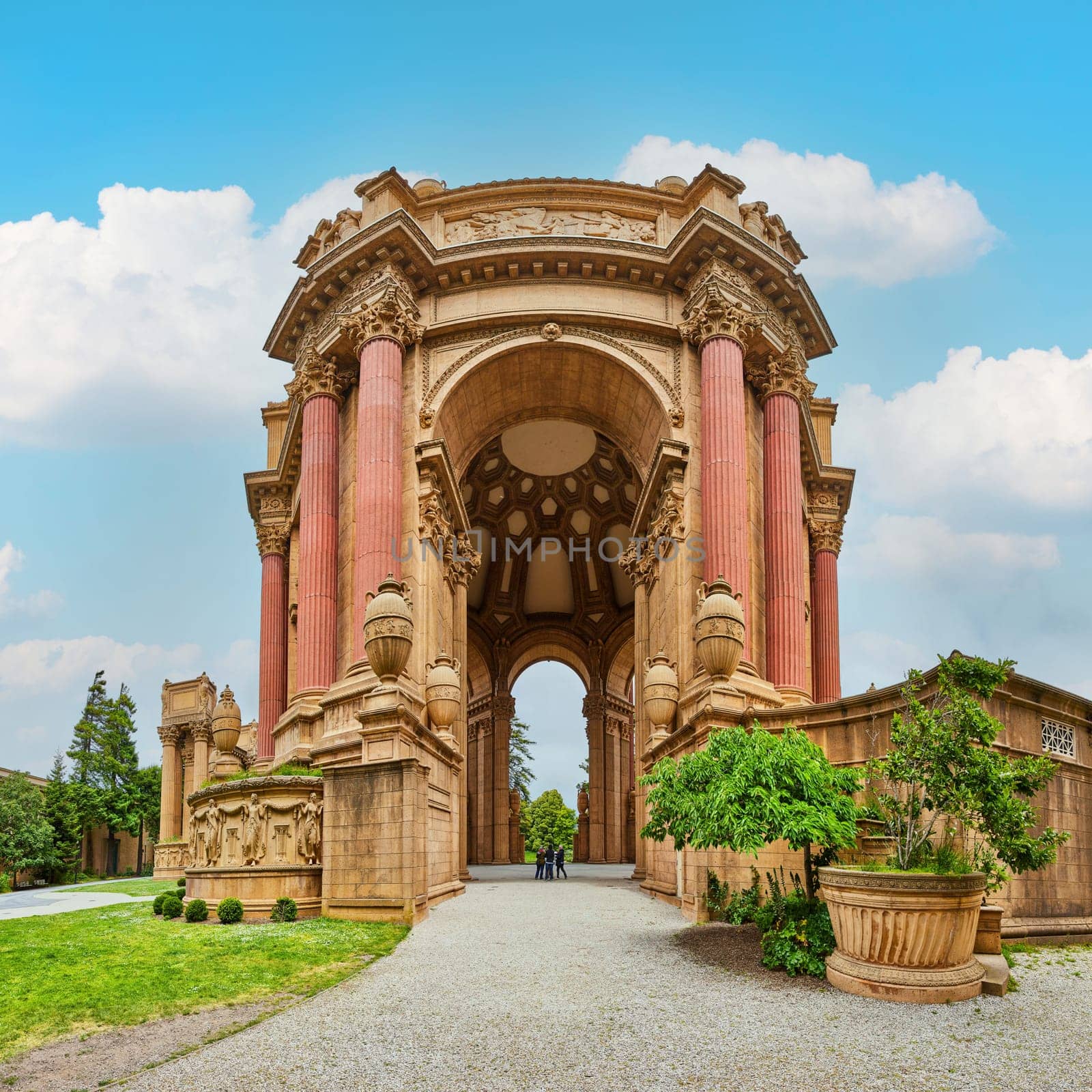 Image of Panorama Palace of Fine Arts with people standing under center of dome structure on blue sky day