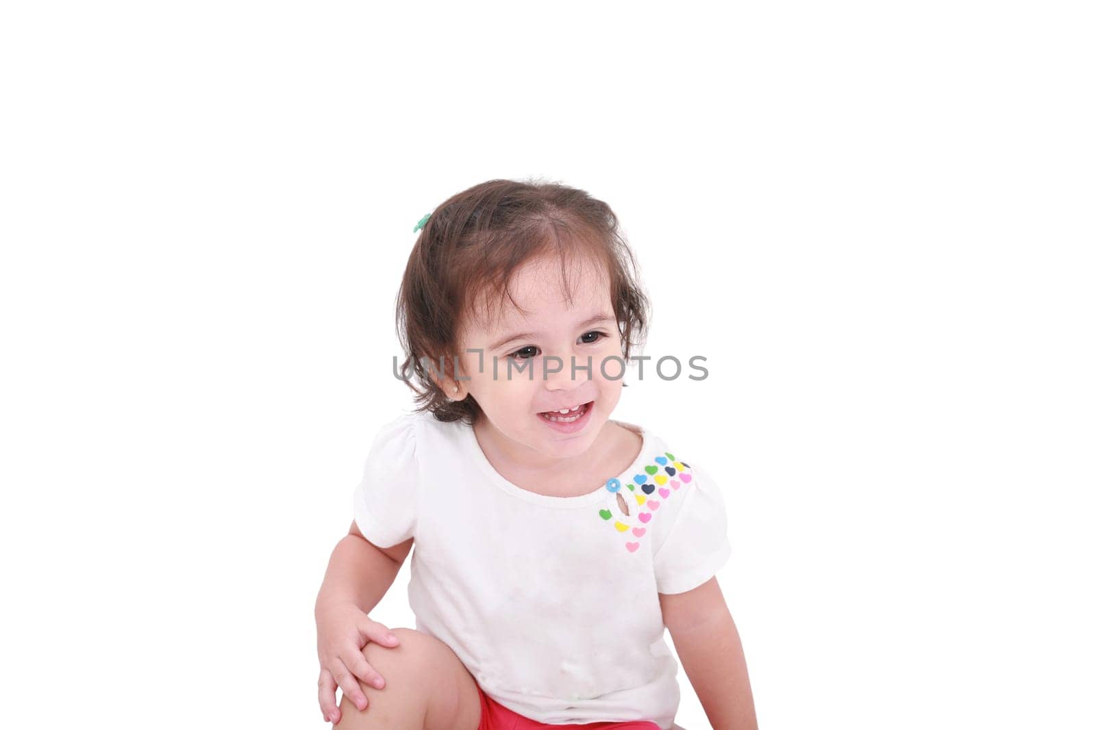 Closeup of adorable little girl smiling cheerfully