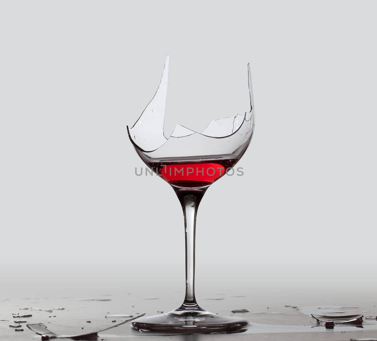 Red wine in a broken wine glass with a partial extraction path saved in the file