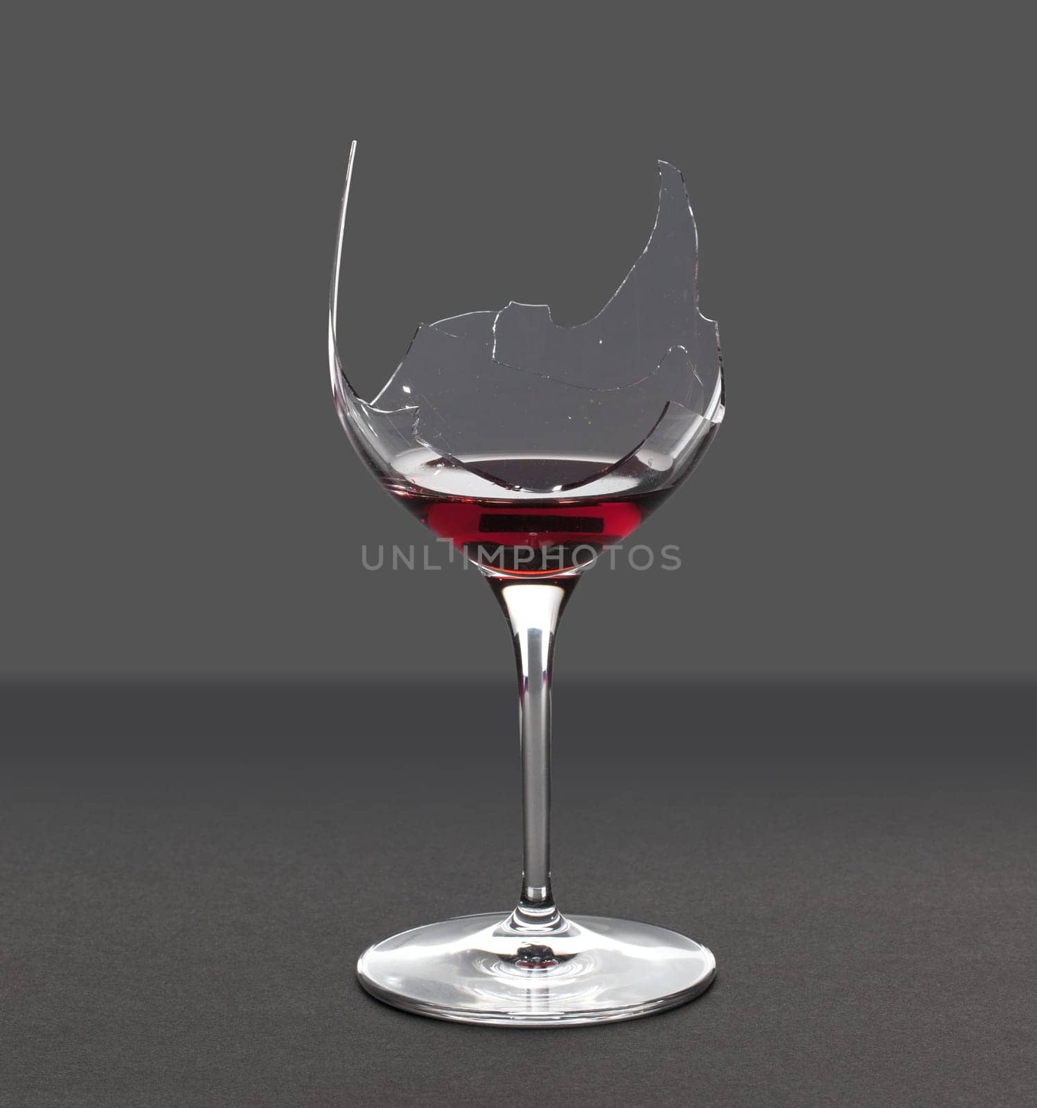 Red wine in a broken wine glass with an extraction path saved in the file