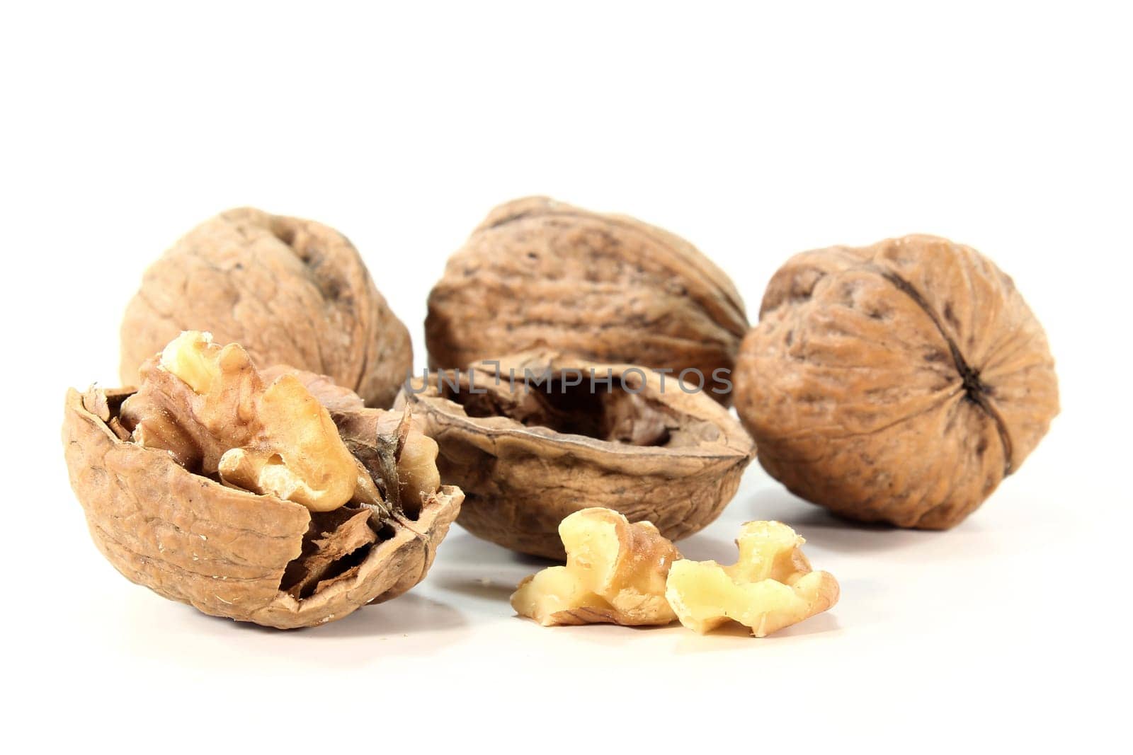a few walnuts on a white background