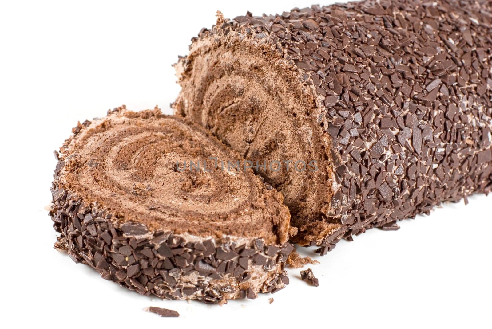Chocolate Swiss roll closeup isolated on a white background
