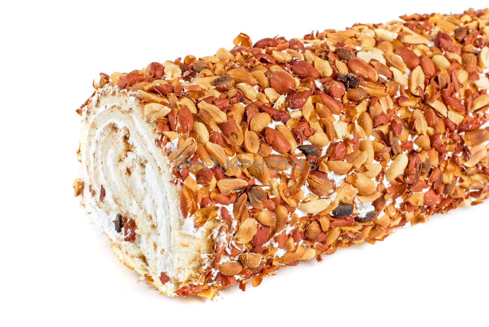 Nuts Swiss roll closeup isolated on a white background