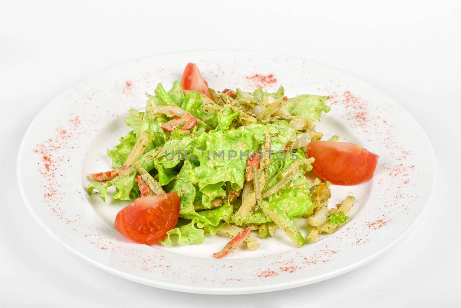 Salad of squid with roast chicken meat, apples, tomatoes, eggs and peppers