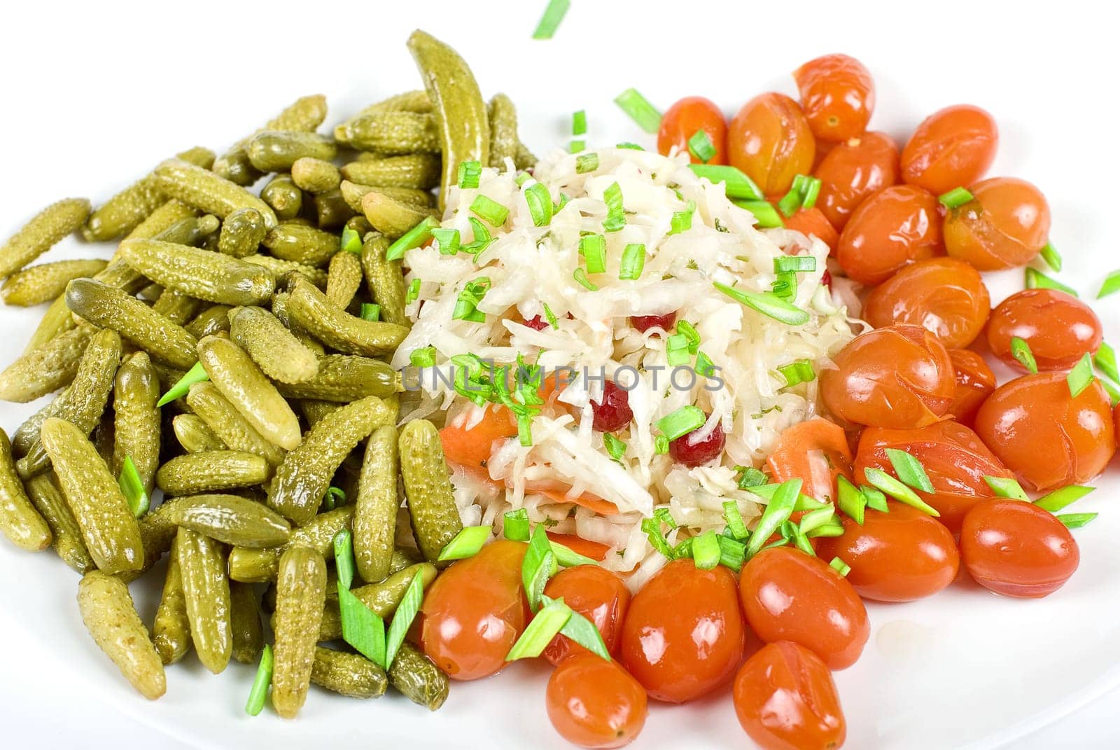 Marinated vegetables at the plate isolated on a white background