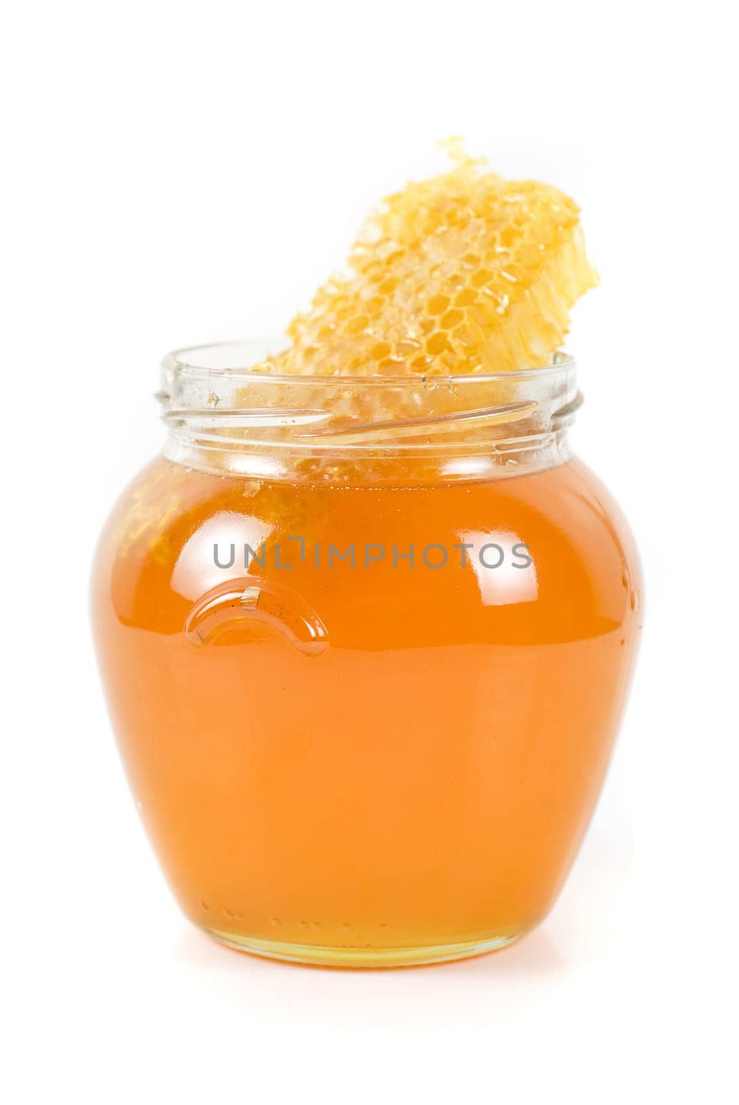 jar of organic honey on white background