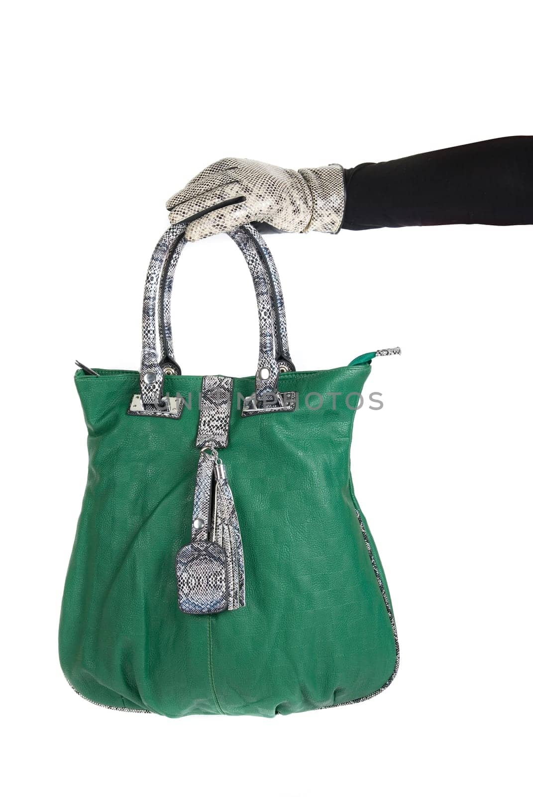 green women bag at hand isolated on white background