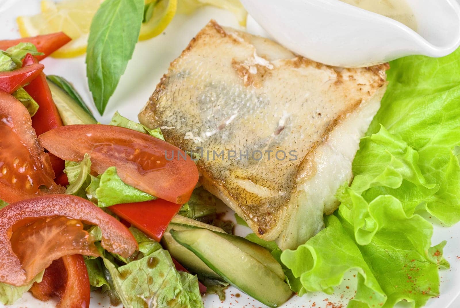Tasty fish pike perch with mix of vegetables