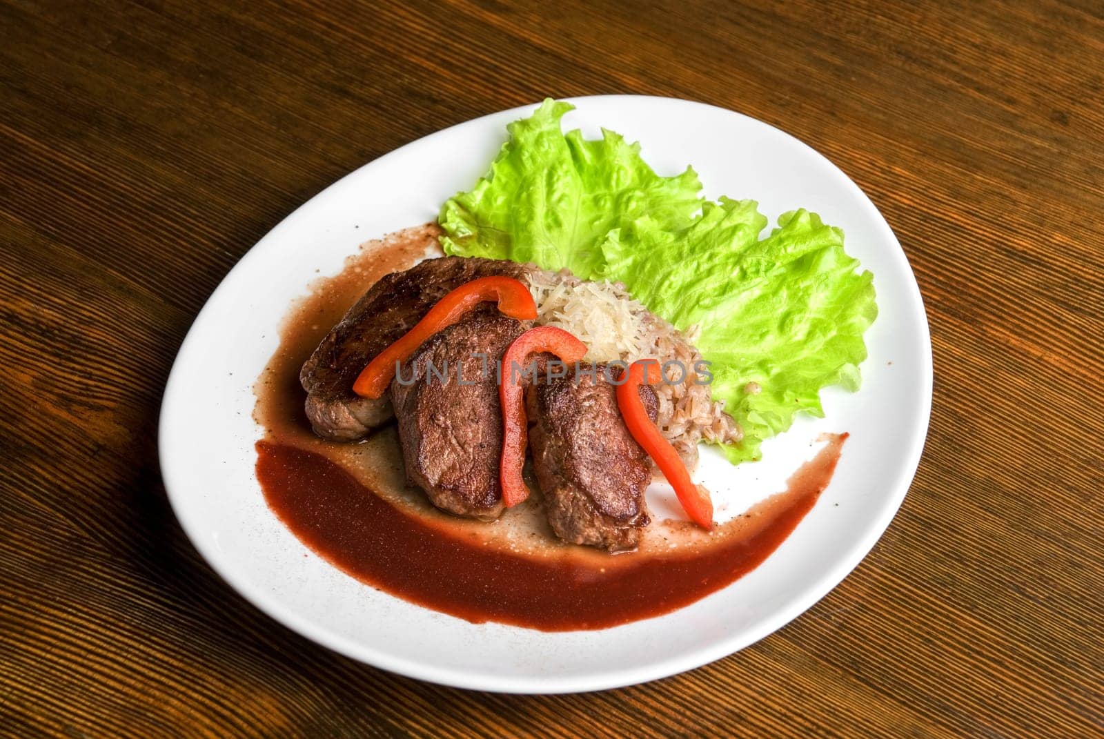 Roast maral meat with blood and garnish pearl barley - very tasty dish