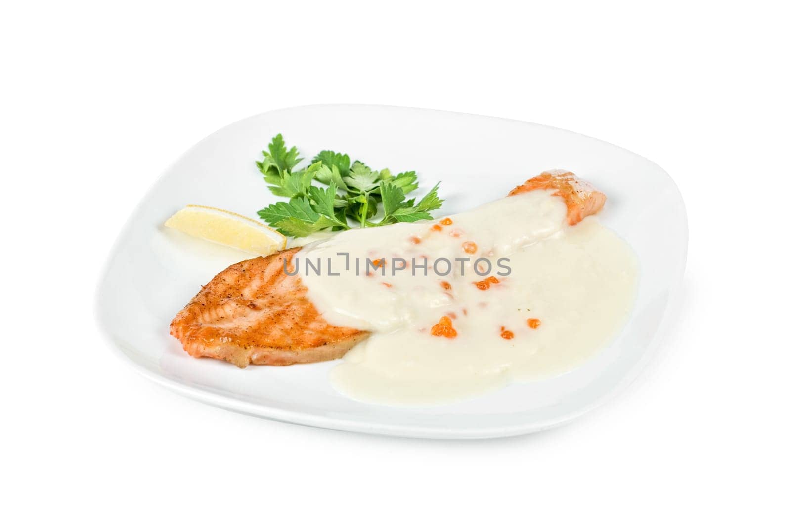 Grilled salmon steak with cheese sauce, greens, lemon and red caviar