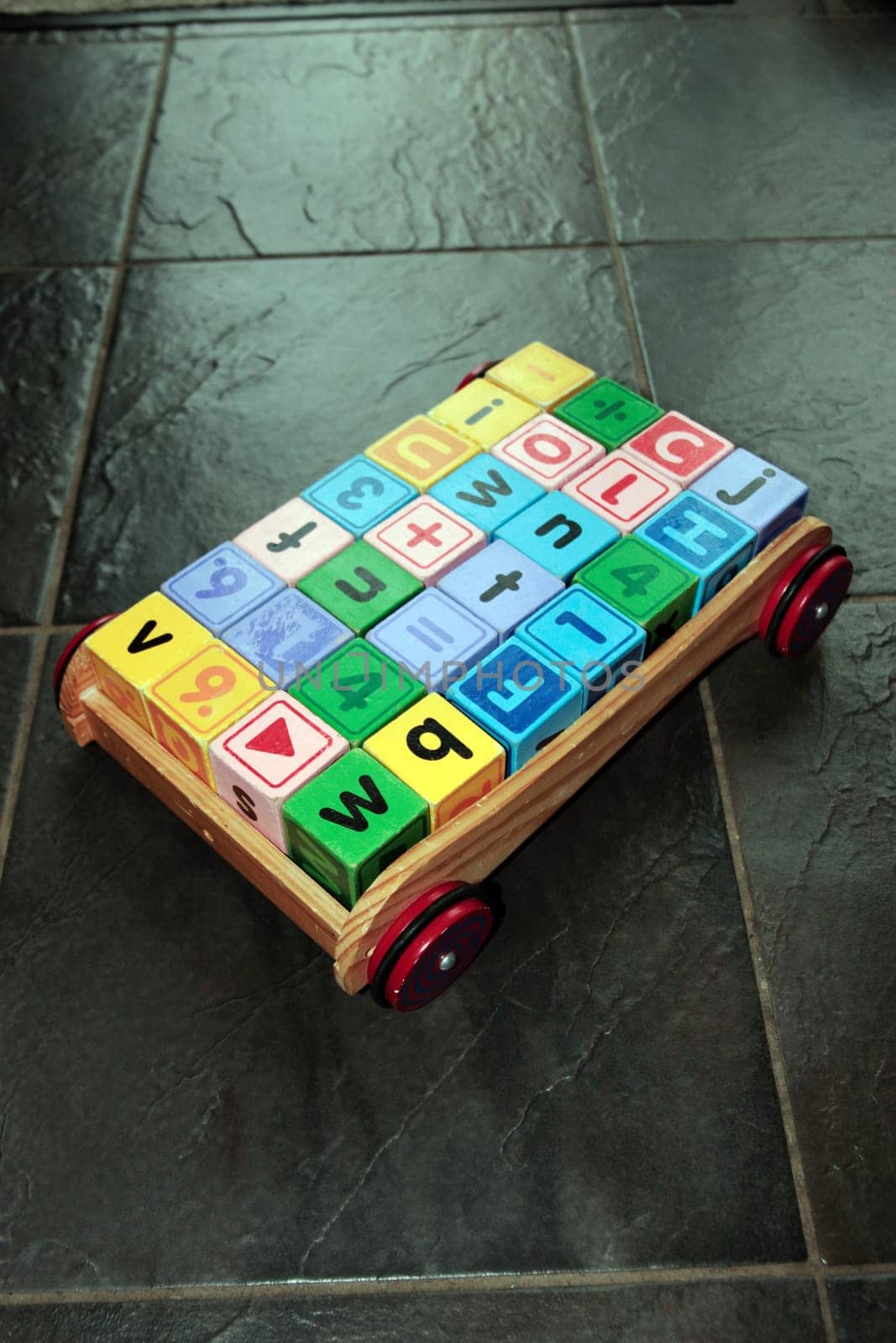 childrens toy letter building blocks in a cart
