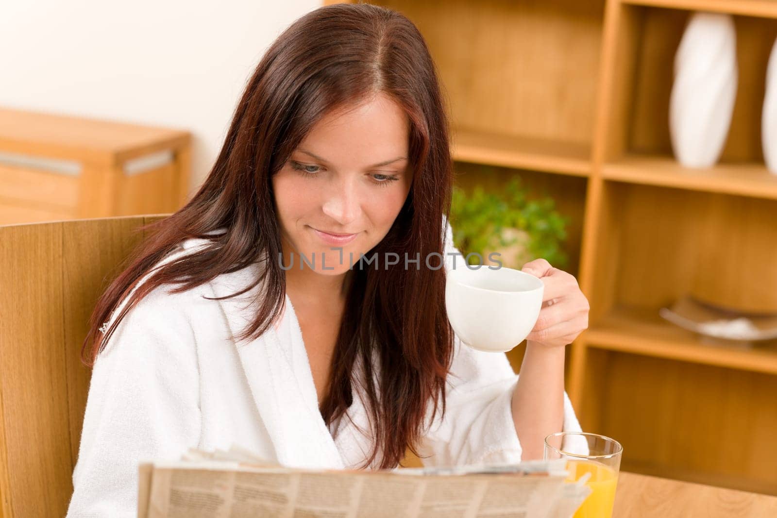 Breakfast coffee and toast happy woman in home bathrobe