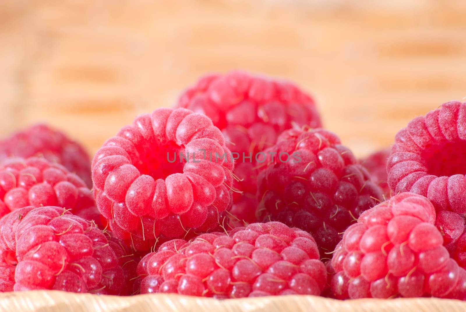 The bast-basket with a raspberry is photographed a close-up