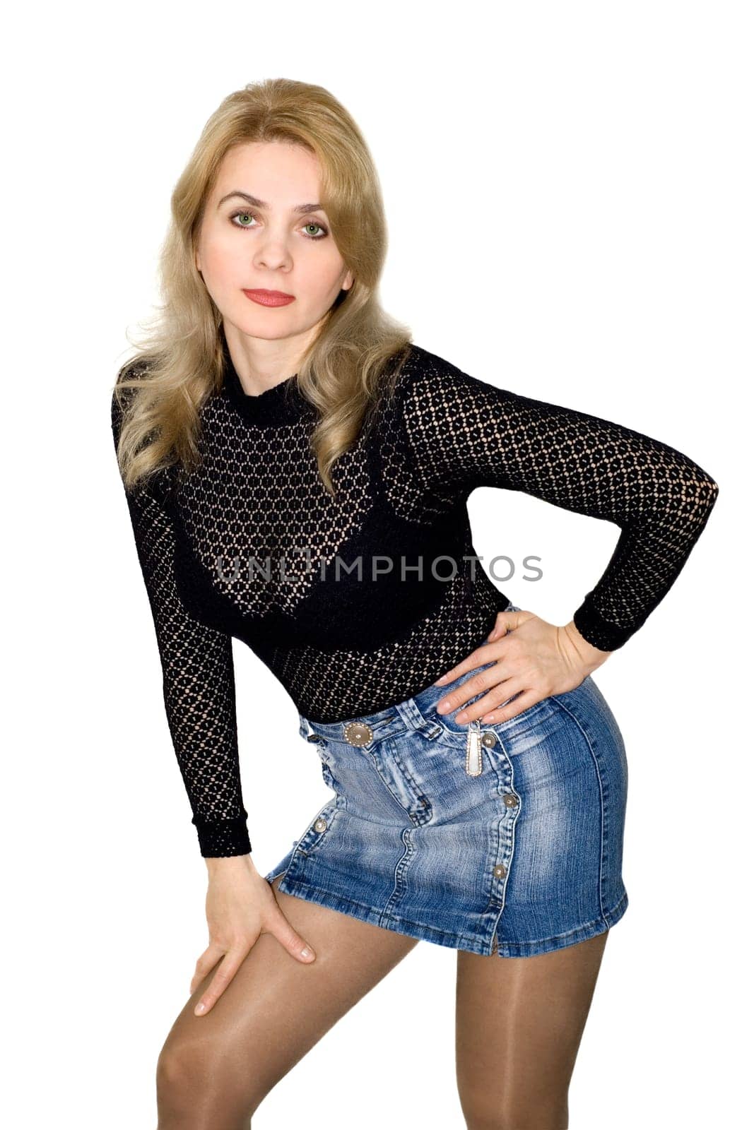 The beautiful woman in a black blouse and a jeans skirt