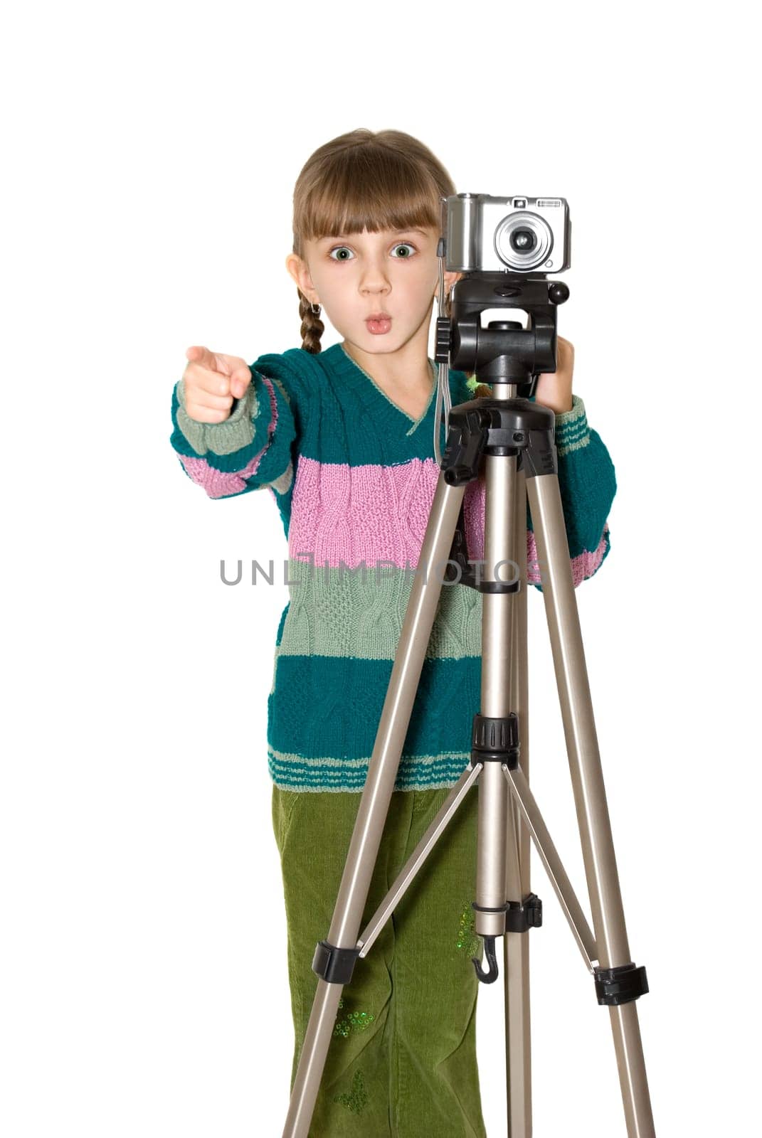 The girl in a color sweater looks out because of the digital camera