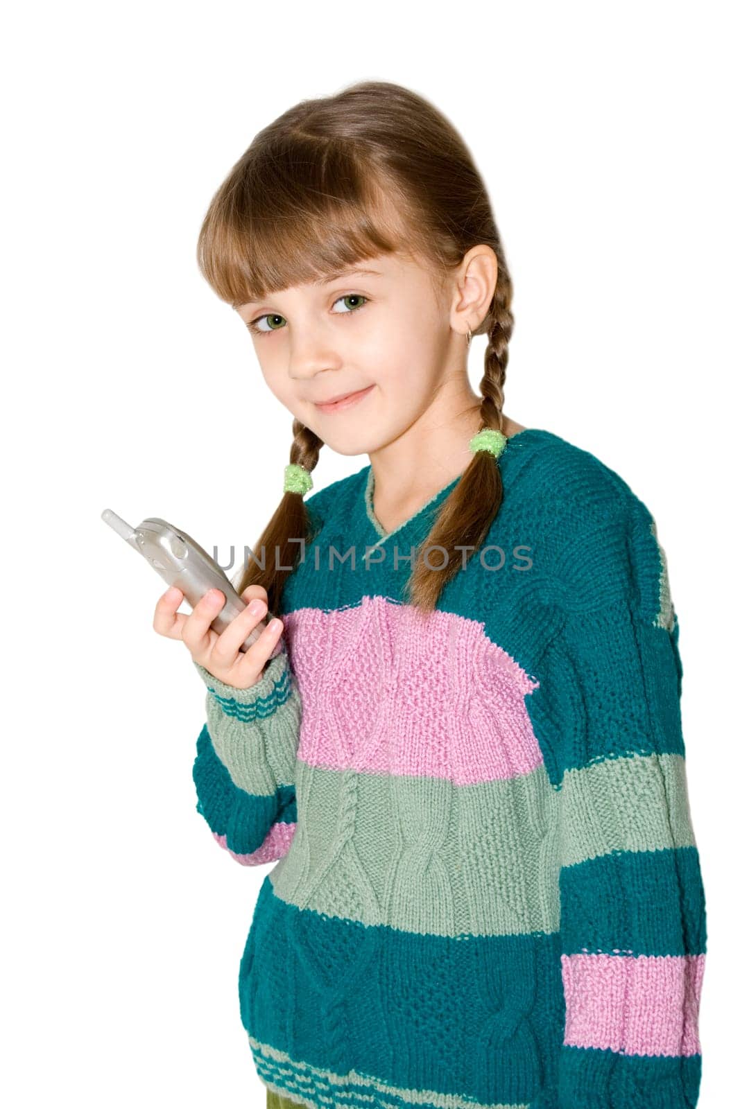 The girl in a color sweater holds mobile phone in a hand