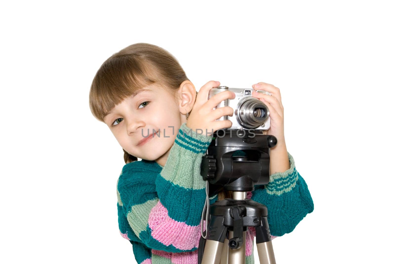 The girl in a color sweater looks out because of the digital camera