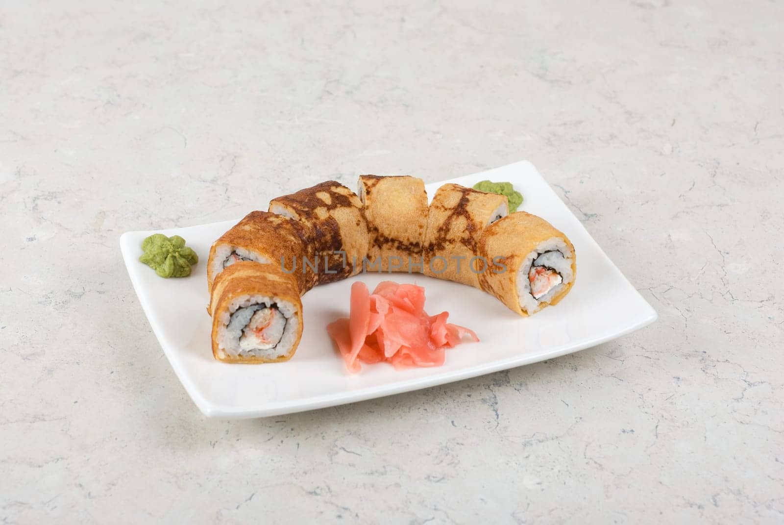 Sushi - made of crab meat, cheese, pancake outside
