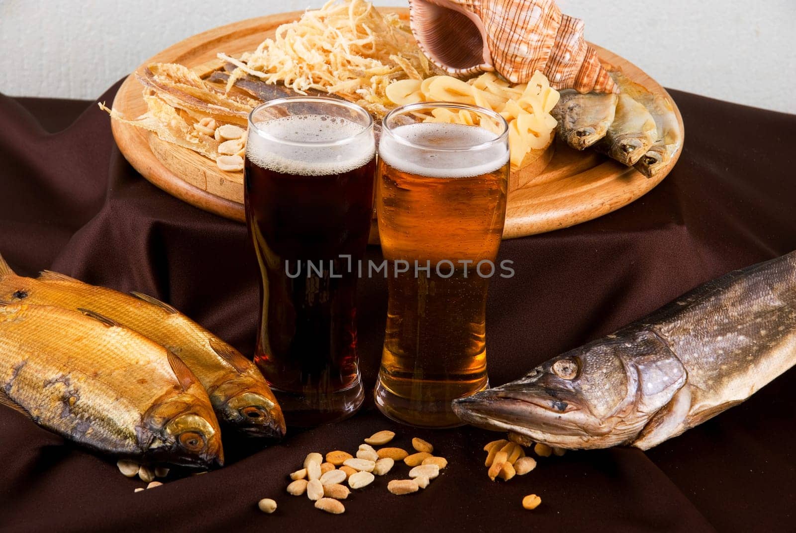 Beer and snacks set: chips, pistachio, shrimp and fish