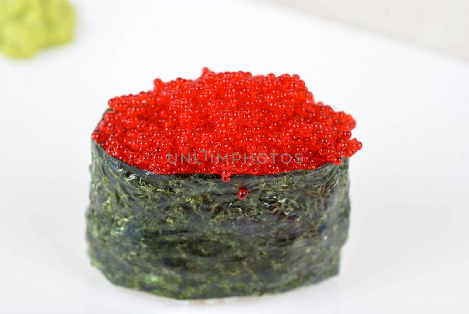 Red tobiko (flying fish roe) sushi closeup
