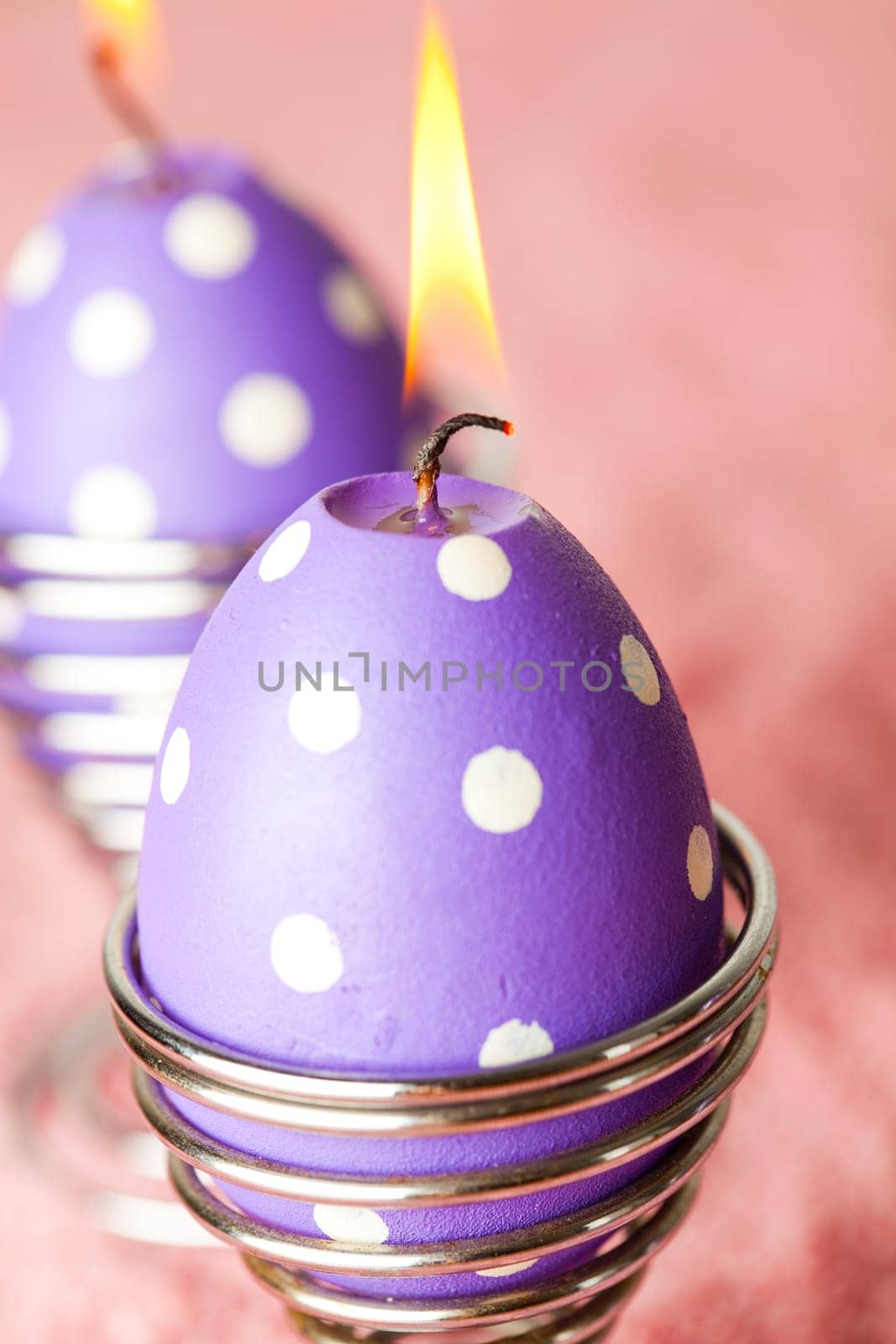 Close-up of purple dotted Easter egg candles