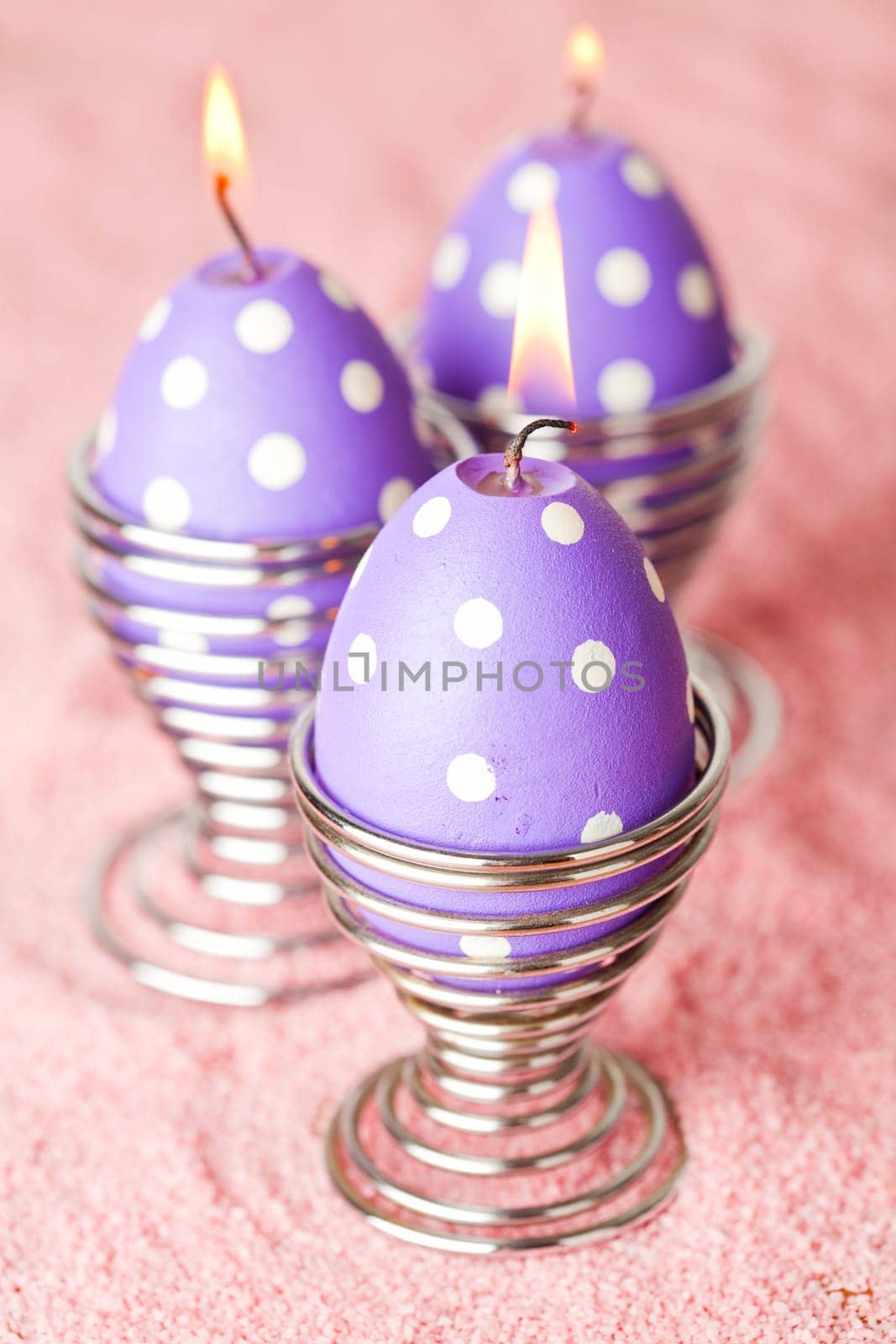 Close-up of purple dotted Easter egg candles