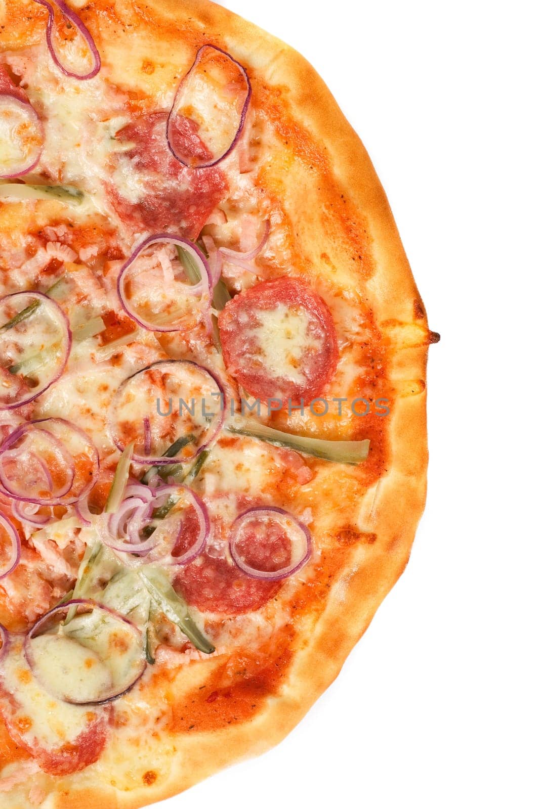 pizza closeup with smoked meat, salami, gherkin, onion and mozzarella cheese