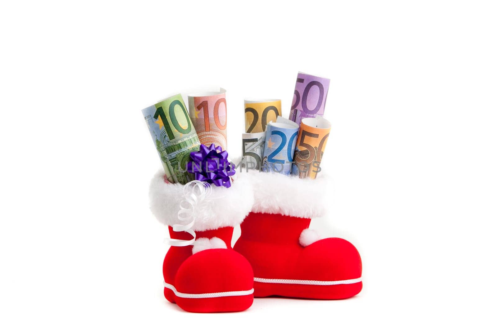Euro in boot of Santa Claus white background