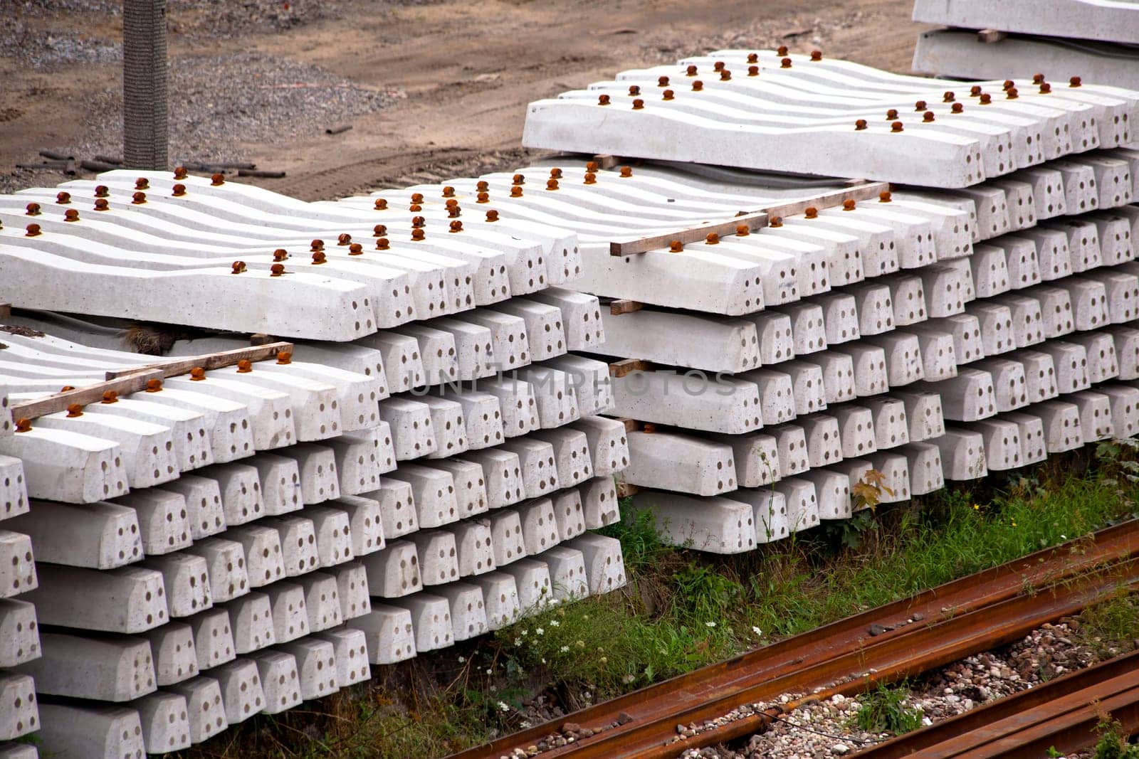 Stack of concrete railway sleepers on the ground