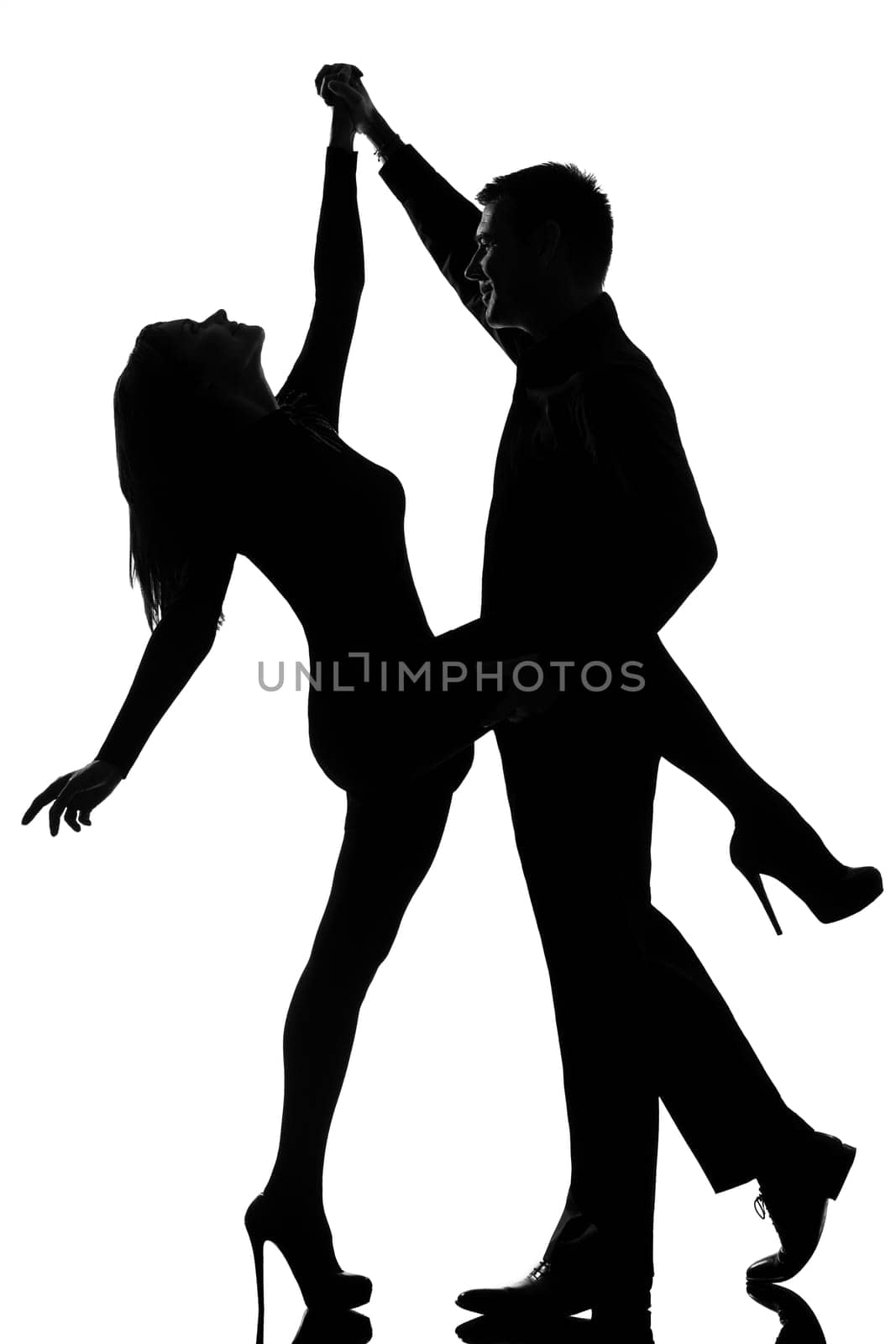 one caucasian couple man and woman dancing rock in studio silhouette isolated on white background