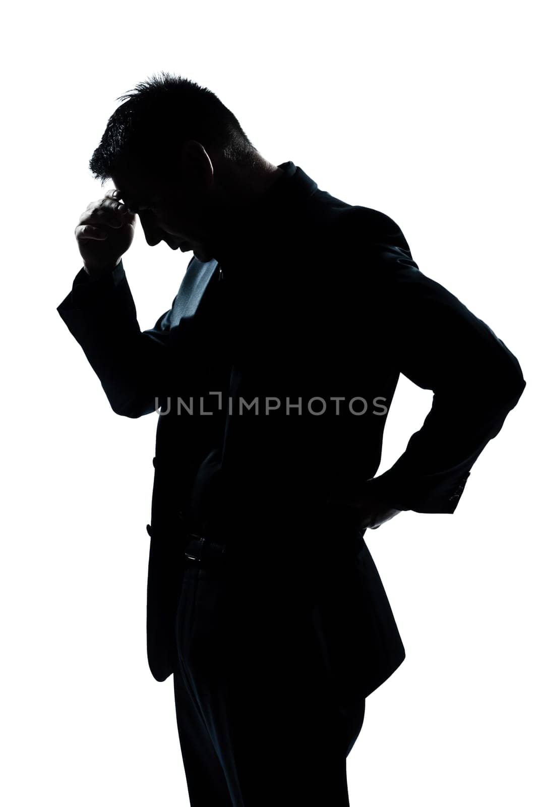 one caucasian man portrait silhouette thinking looking down in studio isolated white background