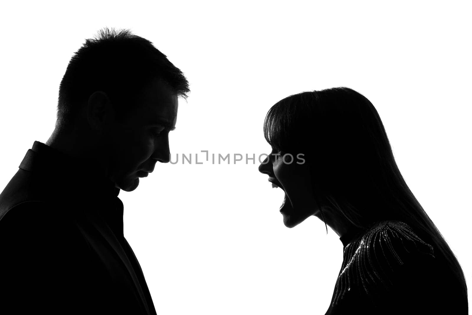 one caucasian couple man and woman face to face screaming shouting dipute in studio silhouette isolated on white background