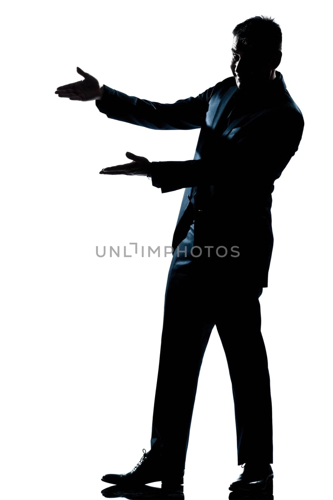 one caucasian man showing pointing empty copy space  full length silhouette in studio isolated white background