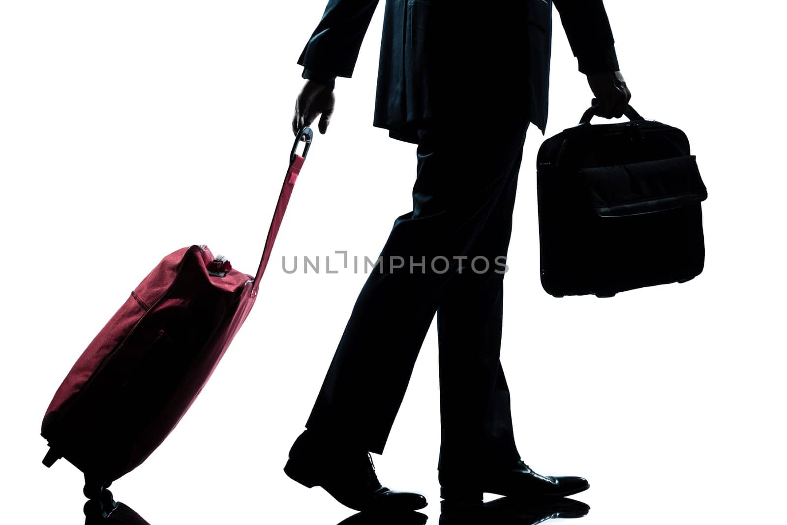 detail side view one caucasian business traveler man walking with suitcase  full length silhouette in studio isolated white background