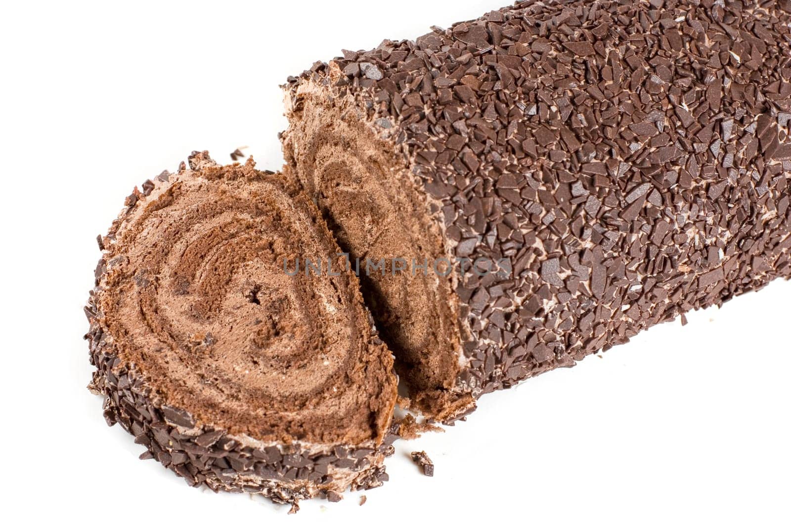 Chocolate Swiss roll closeup isolated on a white background