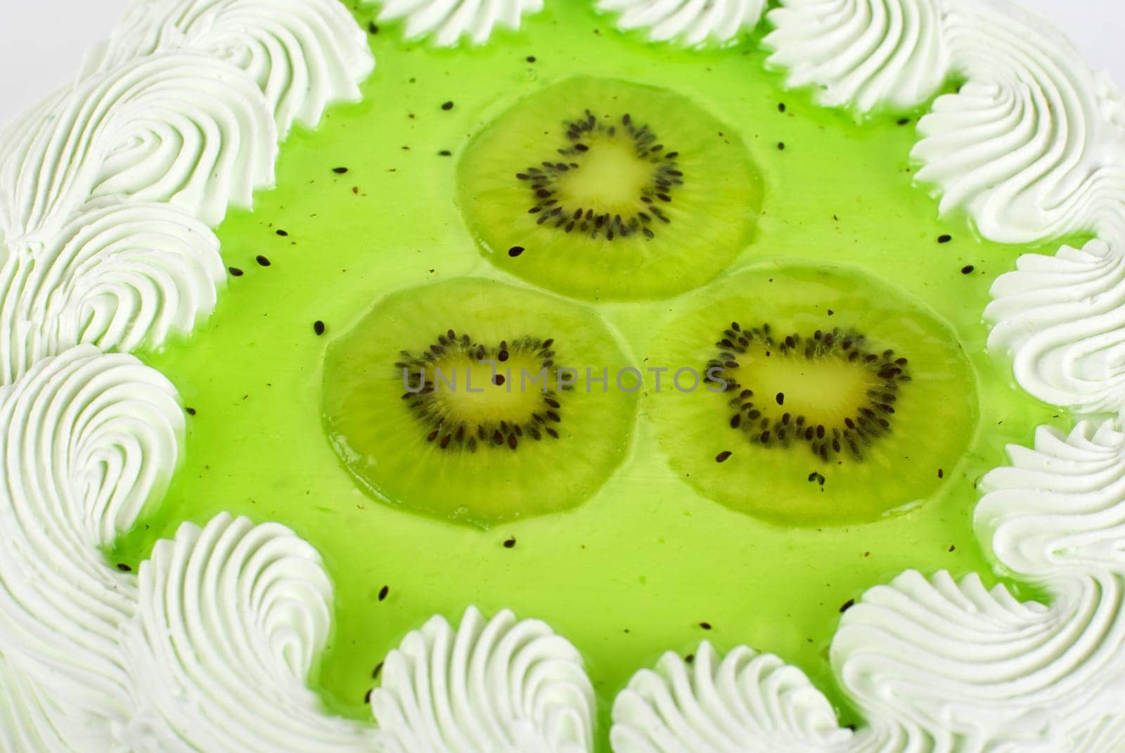 fruit kiwi cake closeup isolated on a white
