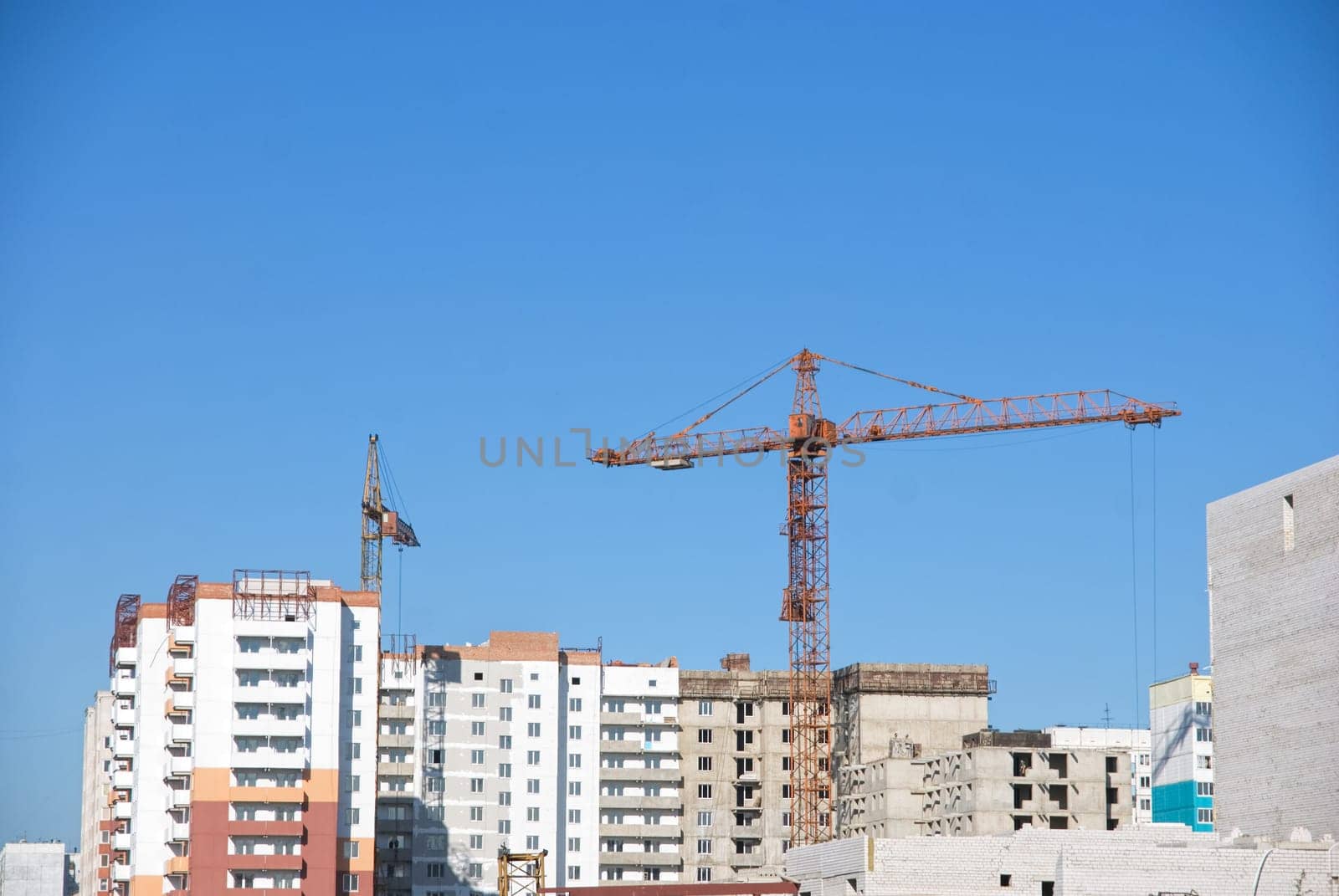crane and building under construction on the skyline