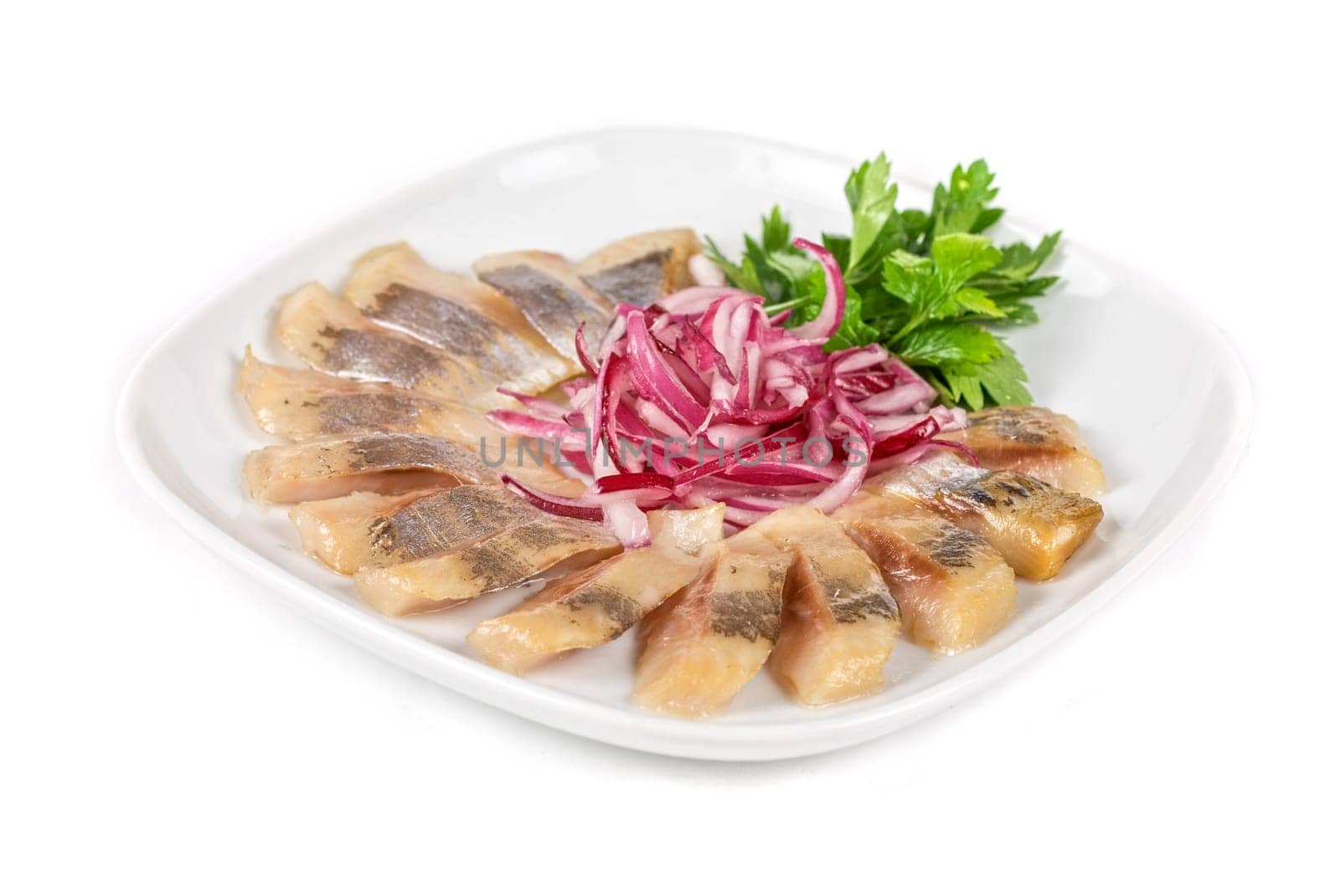 Marinated herring fillets closeup with onion