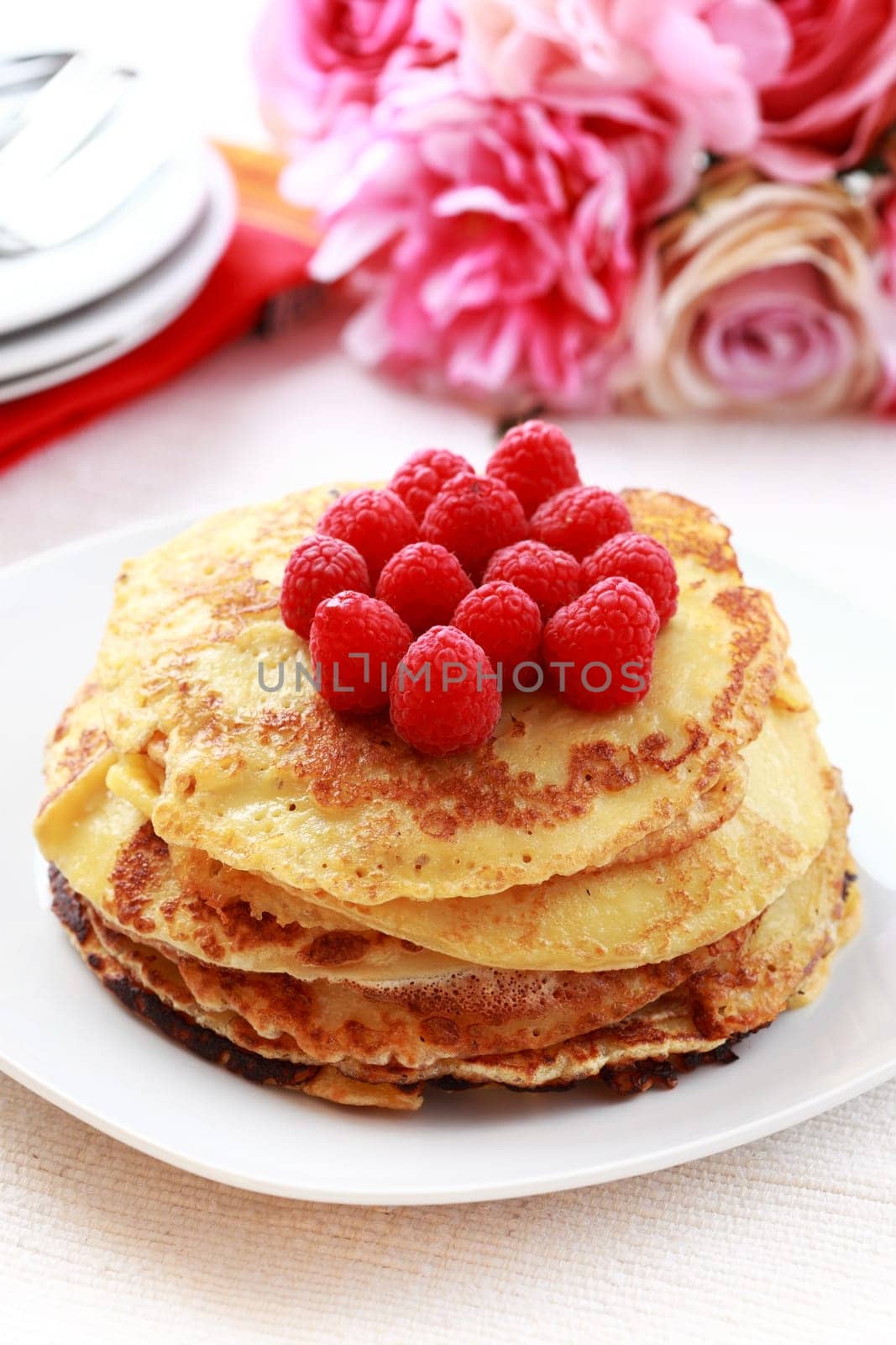 Sweet pancakes with fresh raspberries