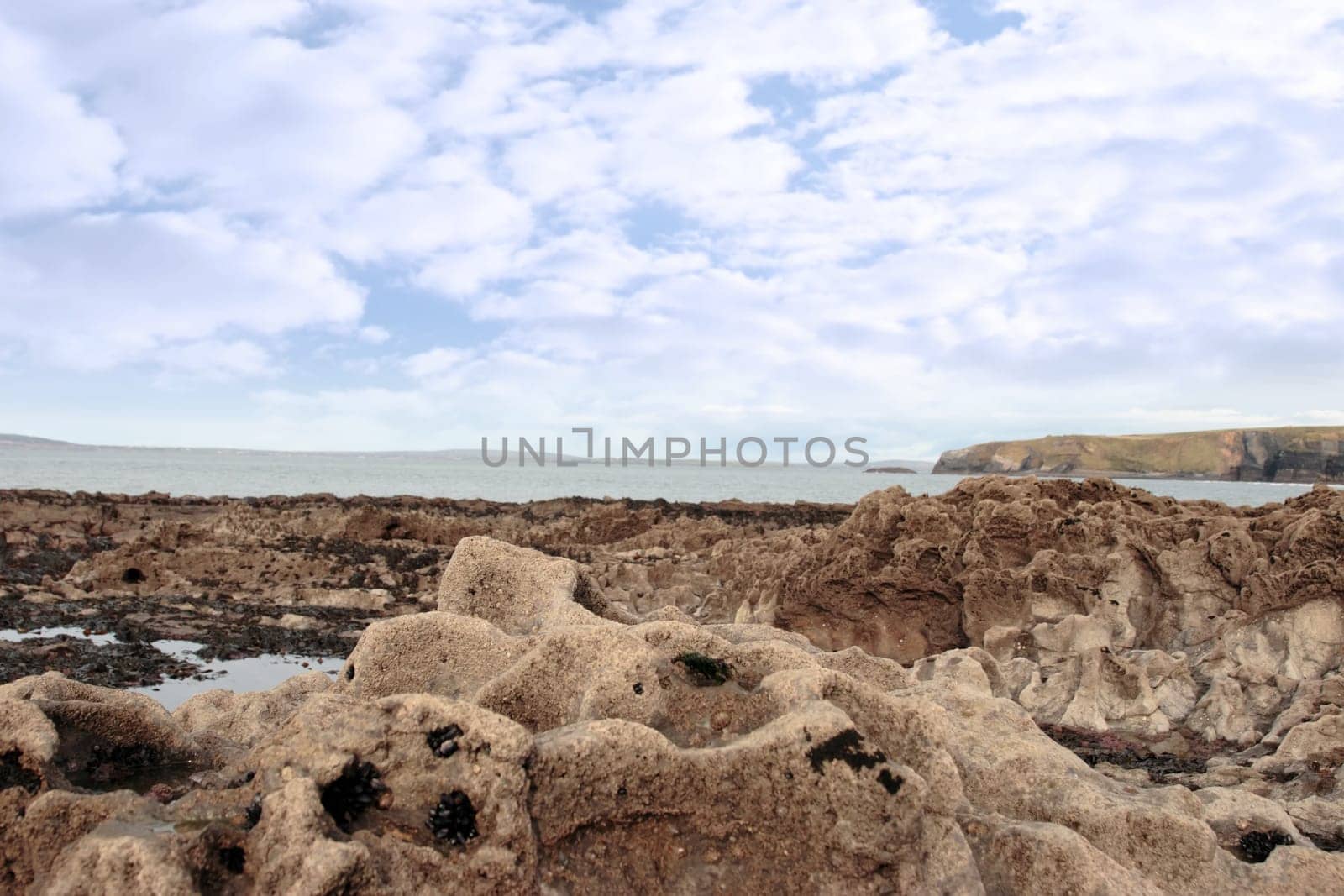 a scenic view of beautiful rocky ballybunion beach in kerry ireland