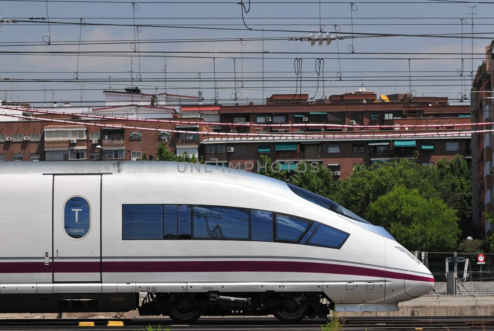 High speed passenger train leaving Atocha railway station in Madrid (Spain).