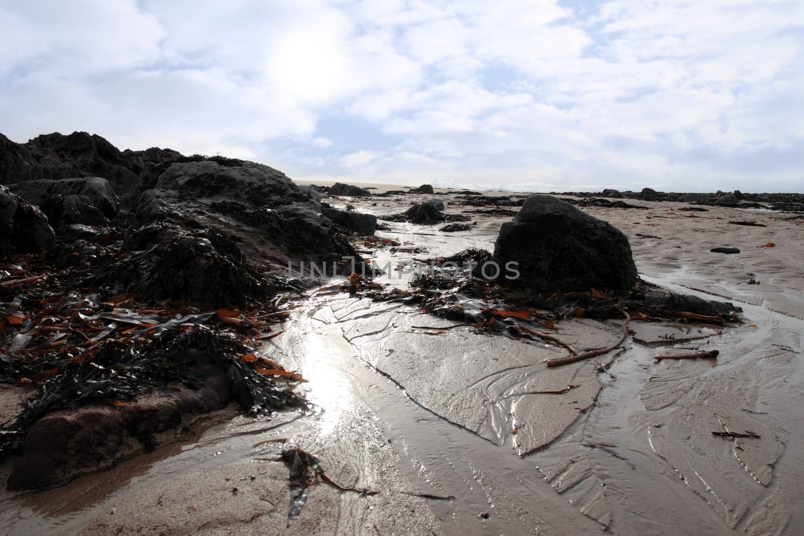 rocks on beale beach co kerry ireland on a cold winters day