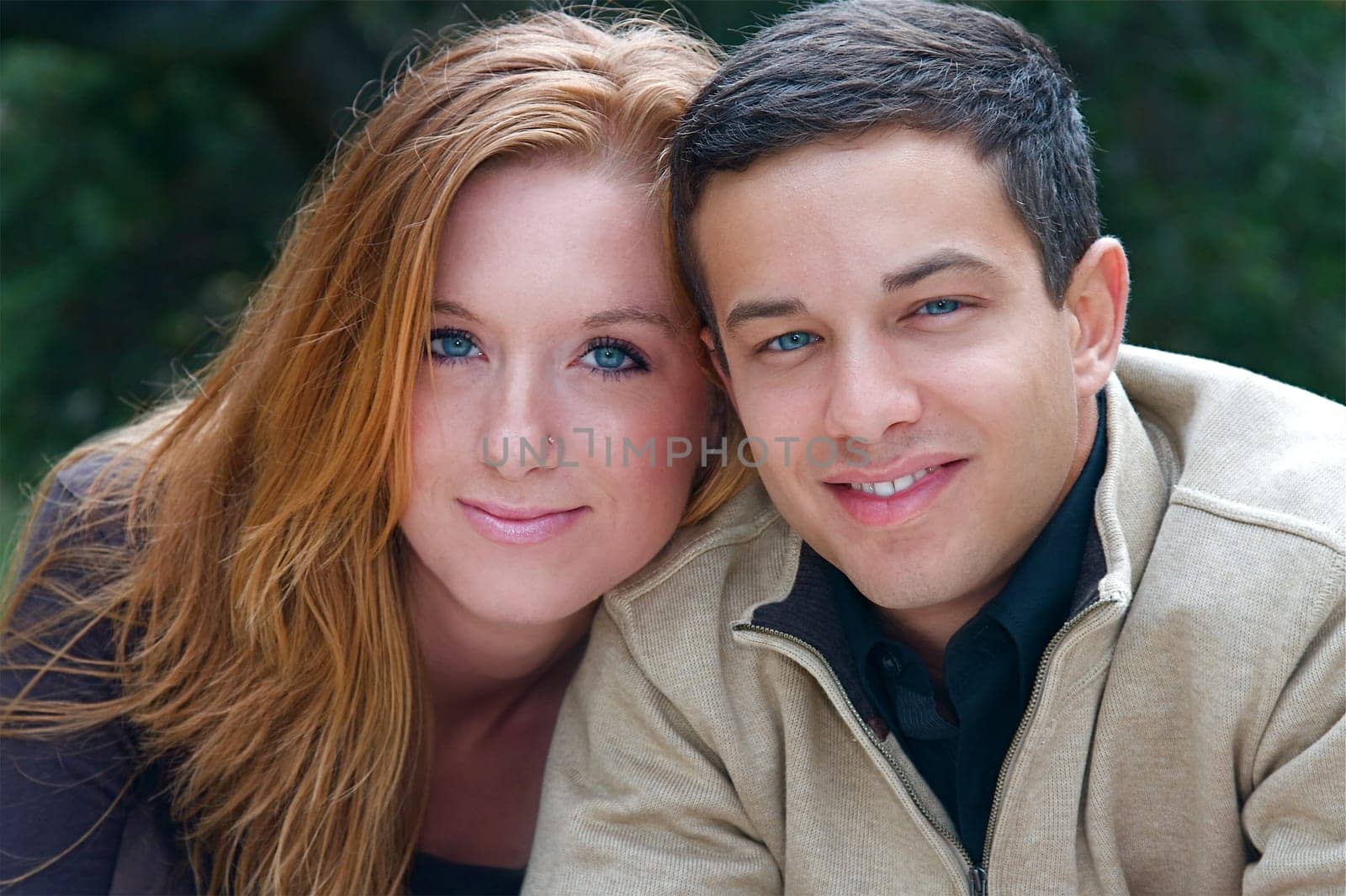 Young couple in an autumn forest picnic area