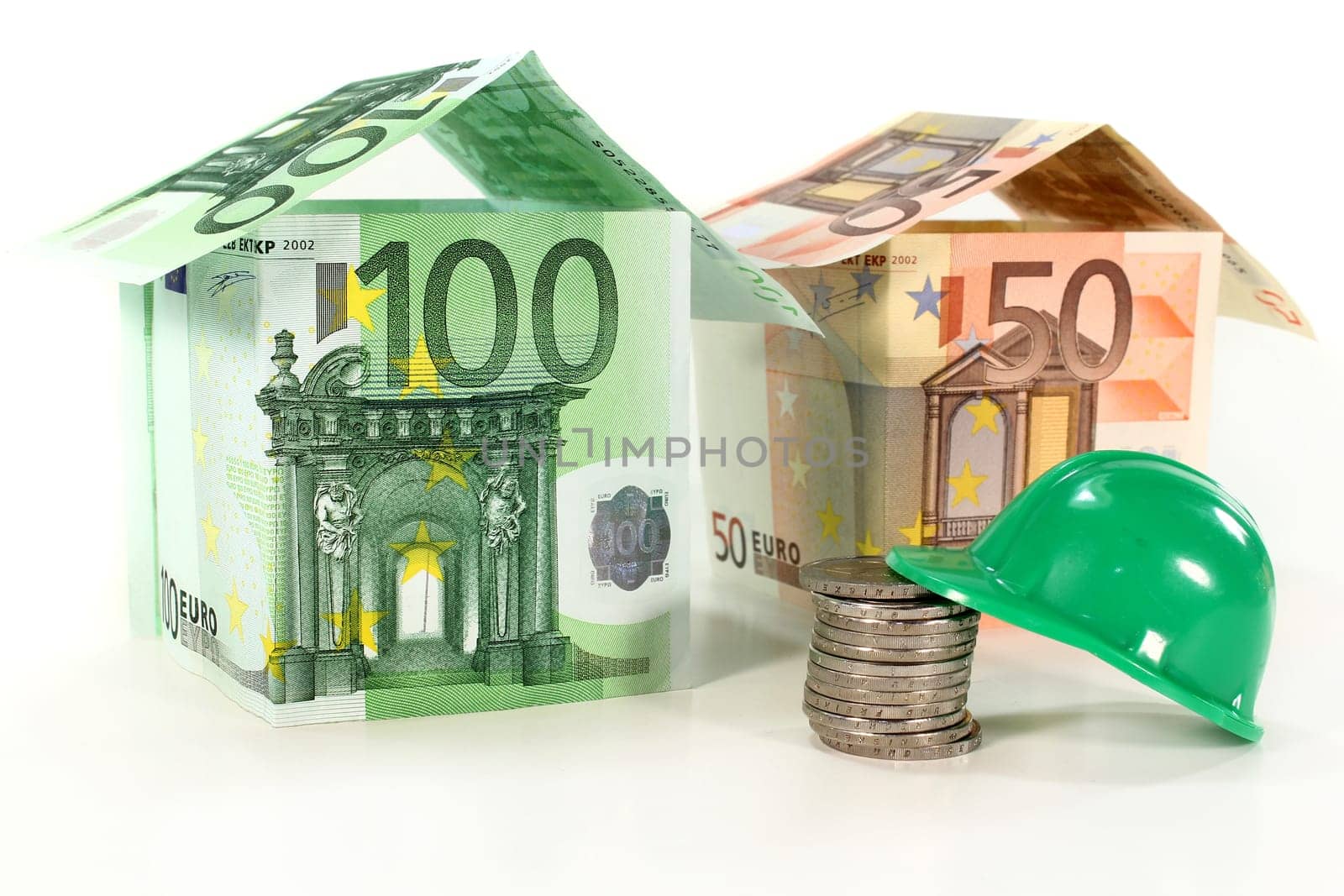 Construction helmet and euro bills against white background
