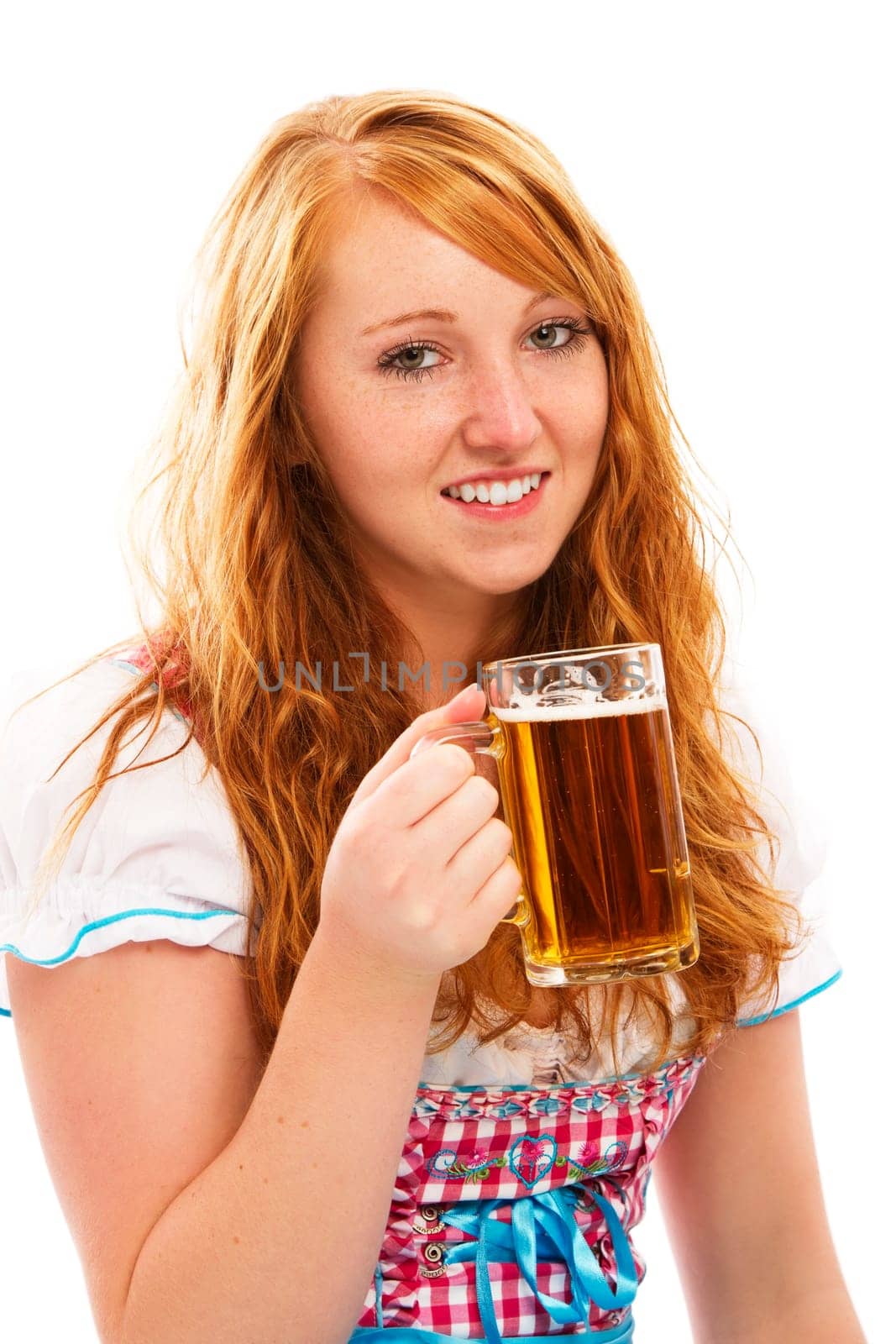 Young woman in dirndl with beer on white background