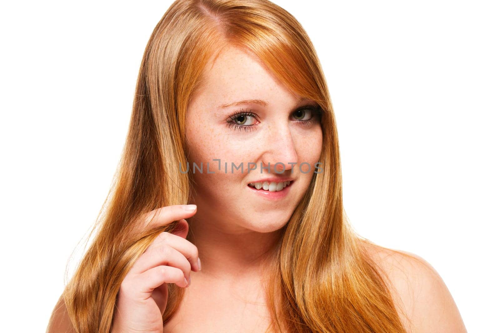 Redhead girl playing with her hair on white background